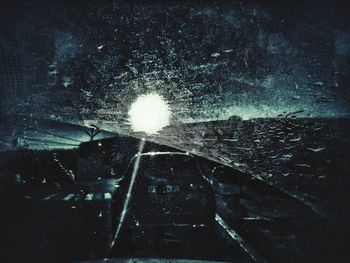 Close-up of wet car windshield during rainy season