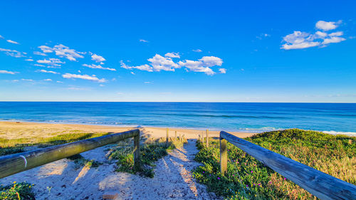 Scenic view of sea against blue sky