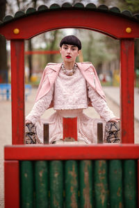 Portrait of young woman standing outdoors