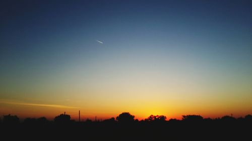 Scenic view of silhouette landscape against sky during sunset