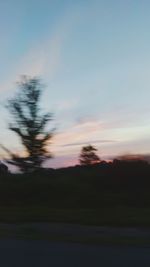 Scenic view of silhouette landscape against sky at sunset