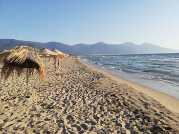 Scenic view of beach against clear sky