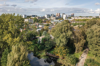 High angle view of trees and buildings against sky