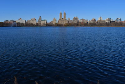 Scenic view of city against clear sky