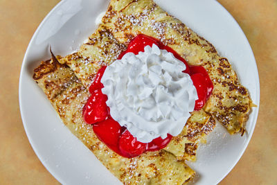 Directly above shot of cake served on plate