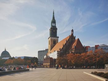 View of buildings in city against sky