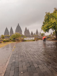 View of temple building against sky during rainy season