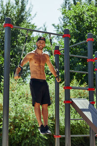 Full length of young man standing in playground