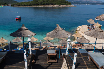 High angle view of chairs on table at beach