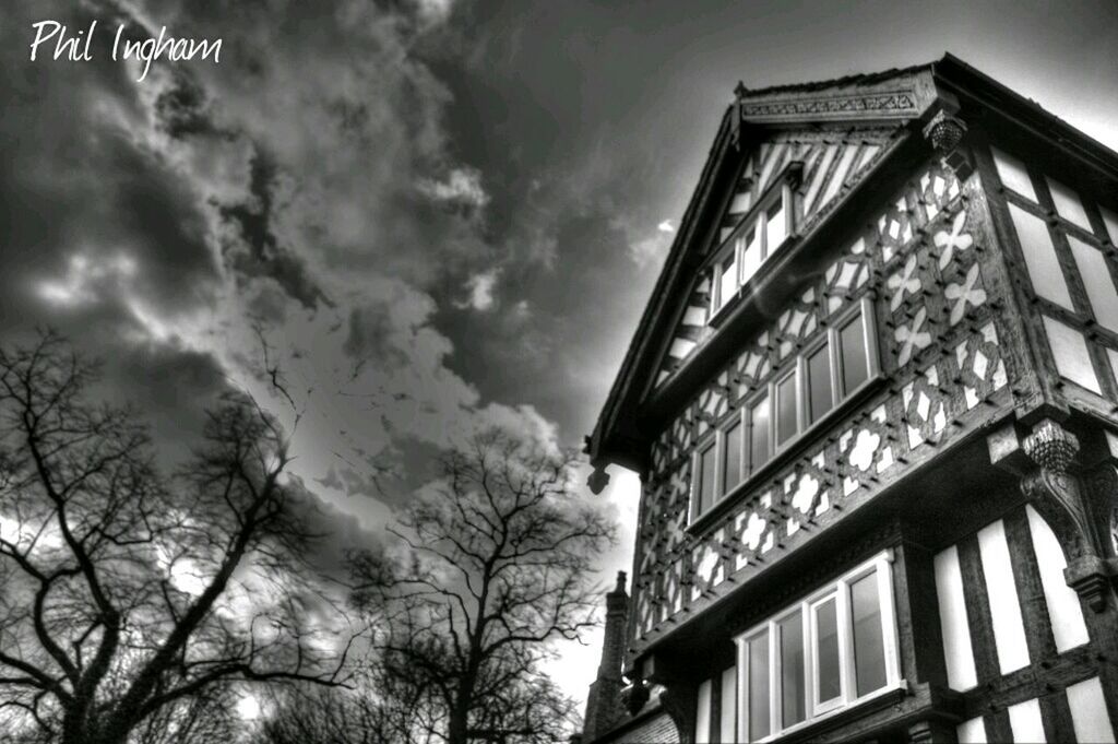 architecture, building exterior, low angle view, built structure, sky, window, cloud - sky, building, residential building, tree, residential structure, cloudy, house, day, outdoors, high section, no people, city, cloud, apartment