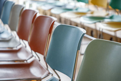 Empty chairs arranged in rows