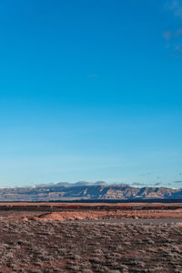 Scenic view of landscape against clear blue sky