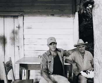 Portrait of young man sitting outdoors