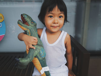 Portrait of smiling girl standing at home