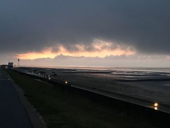 Scenic view of beach against sky during sunset