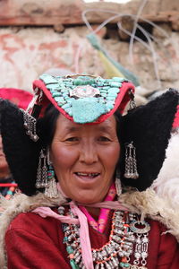 Portrait of a smiling young woman waring traditional costume. 