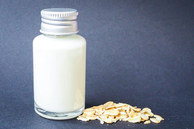 Close-up of drink in glass jar on table