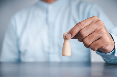 Close-up of human hand holding leaf