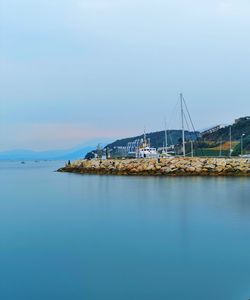 Sailboat on sea against sky