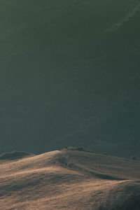 Scenic view of landscape against sky at night