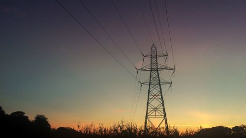 Low angle view of silhouette trees against sky at sunset