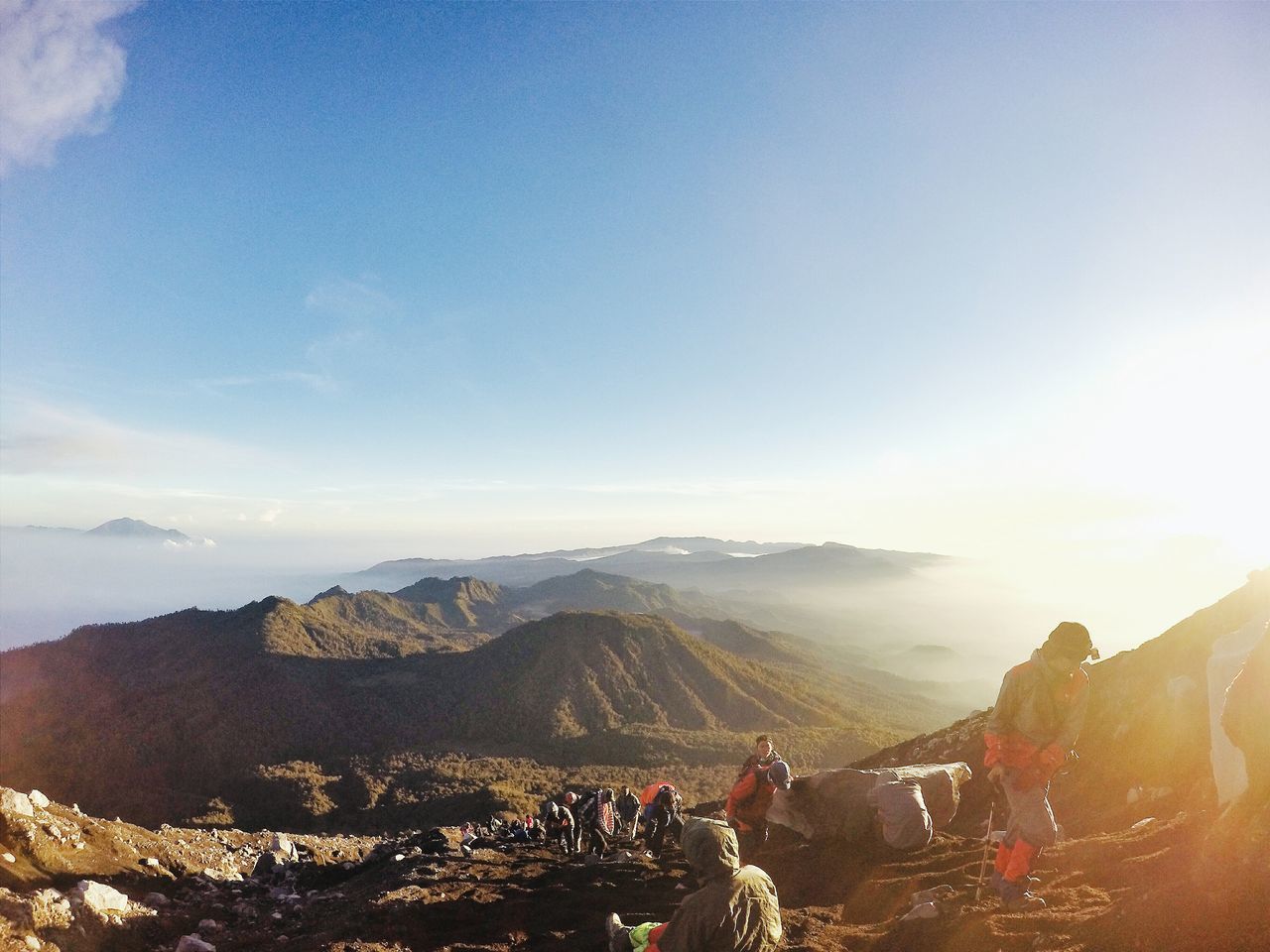 mountain, leisure activity, lifestyles, scenics, sky, large group of people, mountain range, landscape, beauty in nature, men, nature, tourist, tranquil scene, vacations, tranquility, person, high angle view, tourism, travel