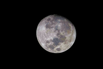 Low angle view of moon against dark sky