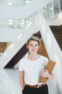 Portrait of young professional in building office hall