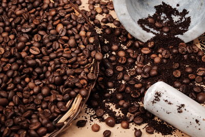 High angle view of roasted coffee bean spilled on table