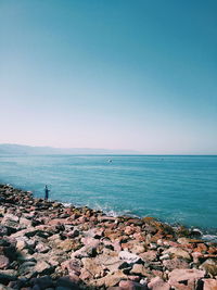 Scenic view of sea against clear blue sky