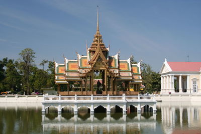 Lake  by bang pa-in royal palace against sky