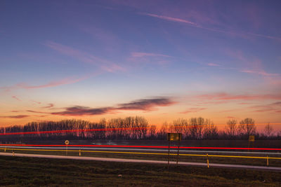 Trees against sky during sunset