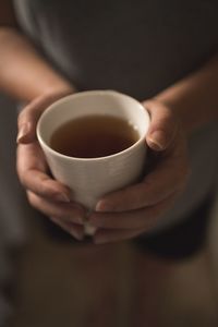 Close-up of woman holding coffee cup