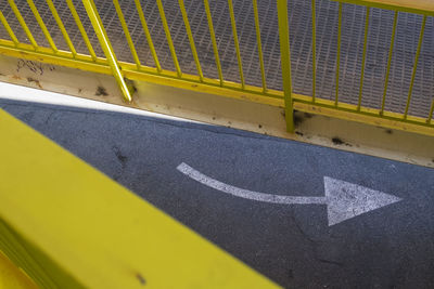 High angle view of arrow sign on road