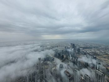 Aerial view of cityscape against sky