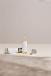Close-up of perfume on colored background