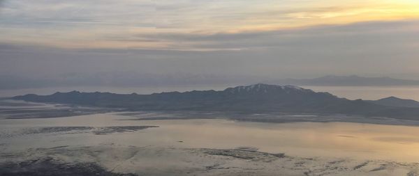 Scenic view of mountains against sky during sunset