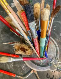 High angle view of paintbrushes in container