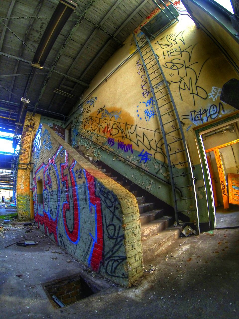 graffiti, architecture, built structure, art, art and craft, creativity, indoors, multi colored, wall - building feature, text, ceiling, building exterior, street art, no people, abandoned, building, day, human representation, mural, interior