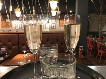 Close-up of wine glass on table at night