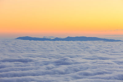 Scenic view of sea against orange sky