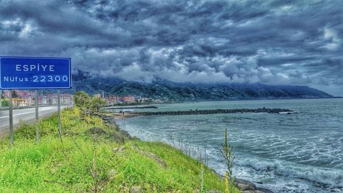 Scenic view of sea against cloudy sky