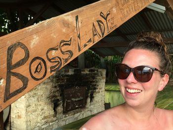 Close-up of happy young woman wearing sunglasses