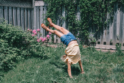 Full length of baby girl in yard