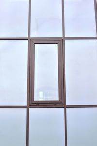 Low angle view of skylight against building