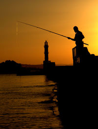 Fishing in the sunset - chania - crete - greece