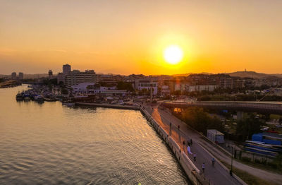 High angle view of city at sunset