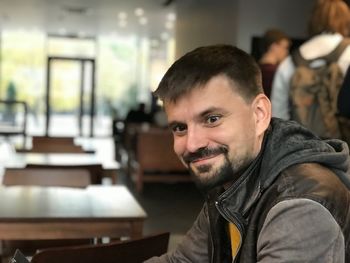 Portrait of smiling man at restaurant