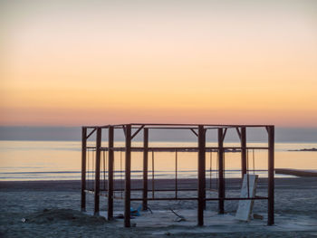 Scenic view of sea against clear sky during sunset