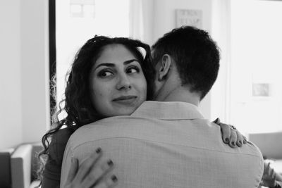 Portrait of young couple kissing